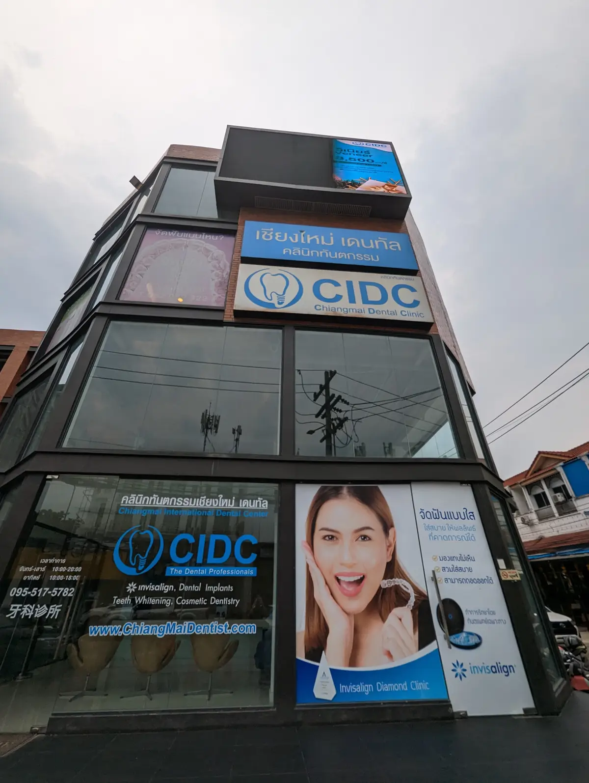 Glass front of a multi-storey building with a CIDC sign above the ground floor windows